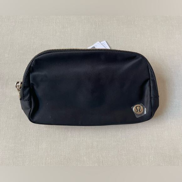 lululemon everywhere belt bag gold buckle Wordmark Crossbody 1L Keep them close in this versatile belt bag that helps you get out the door and on to your next adventure